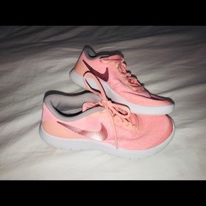 Girls peach Nike sneakers